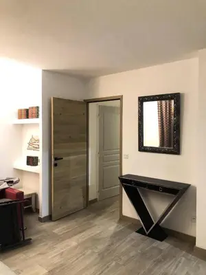 a room with a door and a table with a mirror at Les Coteaux de Pont Royal en Provence - maeva Home - Appartement 4 pièces 7 personnes - Prestige - super Home MAE-2094 in Mallemort