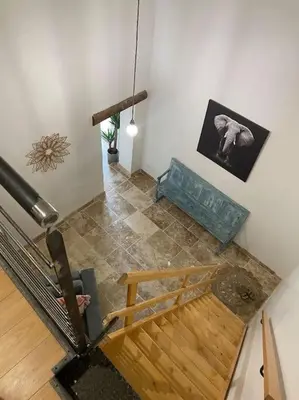 an overhead view of a room with a wooden floor at Maison de charme avec piscine in Monteux