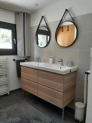 a bathroom with a sink and a mirror at La Colinière, Chambre d'hôtes in Aix-en-Provence