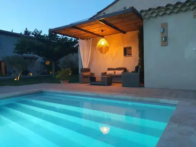 a swimming pool in front of a house at Lou Mazet provençal à Eygalières - Piscine privée in Eygalières