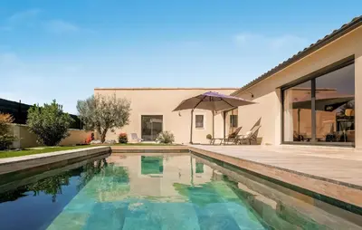 a house with a swimming pool and a patio at Amazing Home In Robion in Robion en Luberon