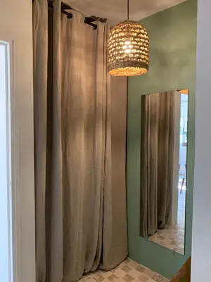 a bathroom with a shower curtain and a mirror at Le Domaine de l'Aiguille Alpilles, Eygalières, Saint Rémy de Provence in Orgon