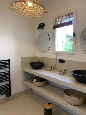 a bathroom with two sinks and a window at Le Domaine de l'Aiguille Alpilles, Eygalières, Saint Rémy de Provence in Orgon
