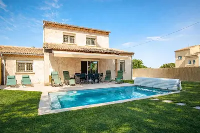 a house with a swimming pool in the yard at Christine's Cabanon in LʼIsle-sur-la-Sorgue