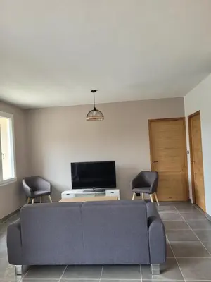 a living room with a couch and two chairs at L'Oustau de Laëtitia Animaux bienvenus in Fontaine-de-Vaucluse