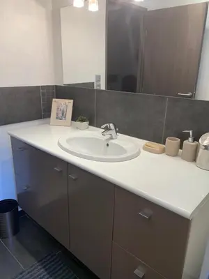 a bathroom with a sink and a mirror at Les Moineaux in Rustrel