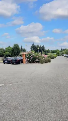 a parking lot with several cars parked in it at Maison confortable Saint-Saturnin in Saint-Saturnin-lès-Avignon