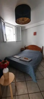 two brown napkins sitting on top of a bed at Appartement indépendant, Hyper-centre pittoresque in Salon-de-Provence