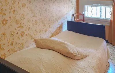 a bed with a pillow on it in a bedroom at Gorgeous Home In Bédoin With Wifi in Bédoin