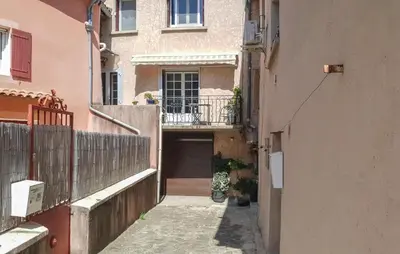 an alley with a building with a balcony at Gorgeous Home In Bédoin With Wifi in Bédoin