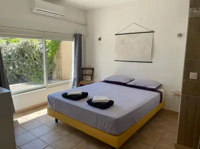 a bedroom with a bed with two towels on it at Les Célestins - Villa en Provence in Carpentras