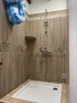 a bathroom with a shower with a shower head at Les Célestins - Villa en Provence in Carpentras