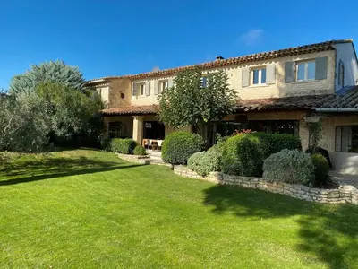 a large house with a lawn in front of it at Mas De Rosemarie in Joucas