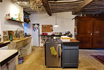 a kitchen with a stove and a counter top at Romantic Provencal house with terrace in Saignon