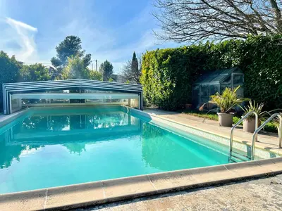 a swimming pool in a yard with a house at Lou Maestoso - Cosy, Campagne, CLIM, 2 personnes in Lançon-Provence