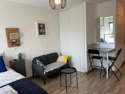 a living room with a couch and a table at Ma place au sud 1 in Éguilles