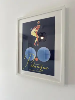 a framed picture of a woman in a bikini and sunglasses at Ma place au sud 1 in Éguilles