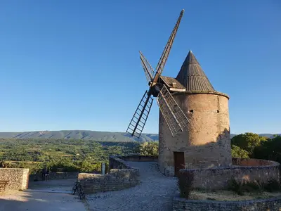 a windmill sitting on top of a hill at Charming village house in Goult in Goult