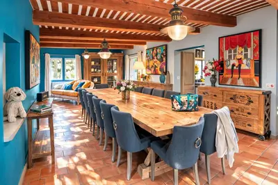 an arched mirror in a living room with a table at Ravissante Bastide Provencale 5 etoiles - Cadre idyllique - Piscine chauffée in Bonnieux