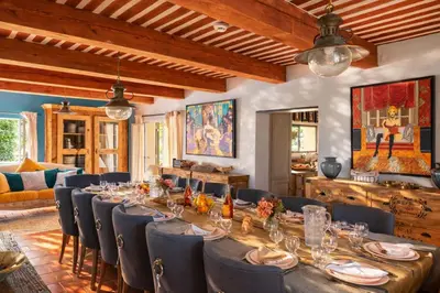 a kitchen with blue walls and wooden cabinets at Ravissante Bastide Provencale 5 etoiles - Cadre idyllique - Piscine chauffée in Bonnieux