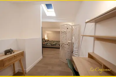 a hallway with a door leading to a bedroom at Le Craponne - Magnifique appartement cours principal plein centre avec parking in Salon-de-Provence