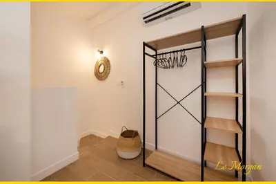 a room with a glass door and a shelf at Le Morgan - Magnifique appartement cours principal plein centre avec parking in Salon-de-Provence