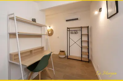 a room with a closet with a desk and a door at Le Morgan - Magnifique appartement cours principal plein centre avec parking in Salon-de-Provence