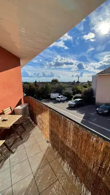 a patio with a fence and a view of a parking lot at Addis in Salon-de-Provence