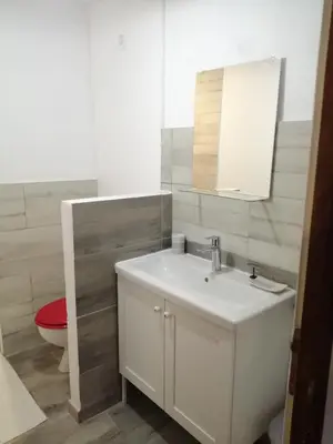 a bathroom with a white sink and a toilet at Gite à la campagne à 15 kms d'Aix in Saint-Cannat