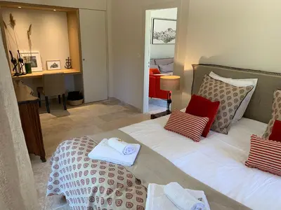 a bedroom with two beds with towels on them at Mas Notre Dame in Eygalières