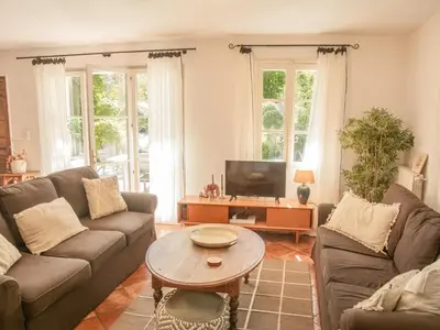 a living room with two couches and a coffee table at Villa Martinet in Carpentras