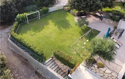 an aerial view of a yard with a soccer ball at Gorgeous Home In Puget in Puget