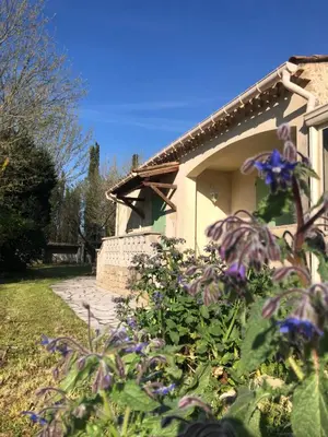 a house in a field with a grass yard at La maison des Sources in Salon-de-Provence