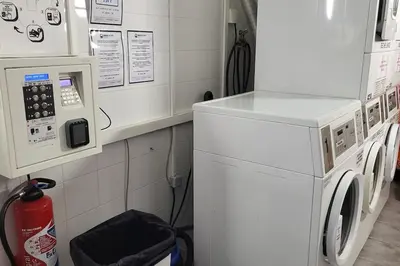 a laundry room with a washer and dryer at maison village vacances demeures du Ventoux in Aubignan
