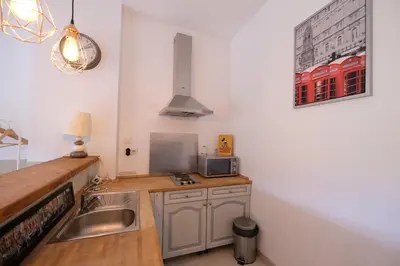 a kitchen with a sink and a counter top at charming provencal house with private pool for 4 people in cheval blanc, luberon. in Cheval-Blanc