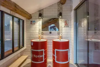a store with two red barrels in a room at Errances Provençales in Saint-Rémy-de-Provence