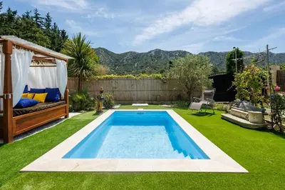 a swimming pool in the middle of a yard at Errances Provençales in Saint-Rémy-de-Provence