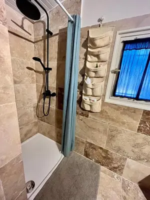 a shower with a glass door in a bathroom at Aix-en-Provence, Maison provençale au calme de la campagne avec Jacuzzi in Aix-en-Provence