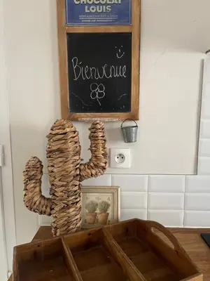 a chalkboard sign and a wooden box in a room at Aix-en-Provence, Maison provençale au calme de la campagne avec Jacuzzi in Aix-en-Provence