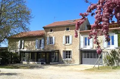 a large brick house with a garage at Maison de 6 chambres avec piscine privée, jardin aménagé et wifi à Pernes-les-Fontaines in Pernes-les-Fontaines