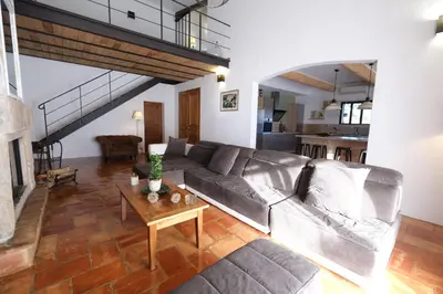a living room with a couch and a table at magnificent individual villa with heated swimming pool, in aureille, in the alpilles - 10 persons in Aureille