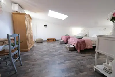 a bedroom with a bed and a table and a desk at magnificent individual villa with heated swimming pool, in aureille, in the alpilles - 10 persons in Aureille