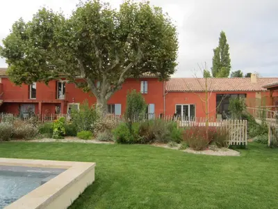 a house with a yard with a pool in front of it at BASTIDE DES MARTELIERES in Salon-de-Provence