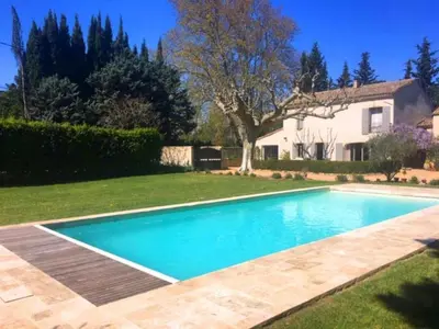 a swimming pool in the yard of a house at Provencal farmhouse, pool, pool house, countryside Plan d’Orgon, Provence - 8 people in Plan-dʼOrgon