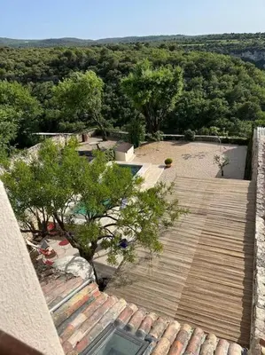 an overhead view of a roof of a house with trees at La Planette in Venasque