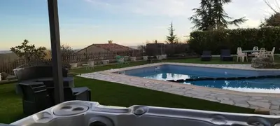 a video game controller in front of a pool at La Halte Gourmande in Vachères