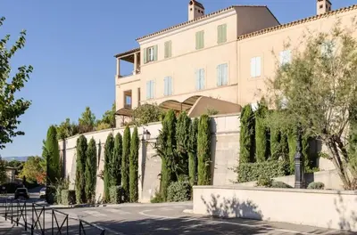 a building with trees in front of it at Les Mas et Villas de Pont Royal en Provence - maeva Home - Villa 5 Pièces 8 Personnes avec piscine privée et vue sur le golf - Exclusive - super Home MAE-6074 in Mallemort