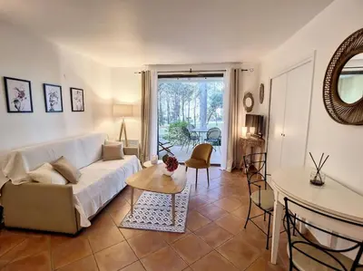 a living room with a couch and a table at Escale détente - Résidence 4* au sein d'un Golf in Saumane-de-Vaucluse