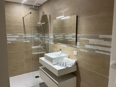 a bathroom with a sink and a shower at Golf de Pont Royal Villa des Alpilles climatisée 3 chambres Piscine chauffée Parking et Garage in Mallemort