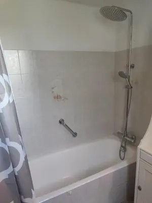 a bathroom with a shower and a bath tub at Studio en pleine campagne in Le Thor